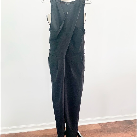 Express Black stretch jumpsuit. Low v neck front & opening below breast line. - Picture 3 of 9